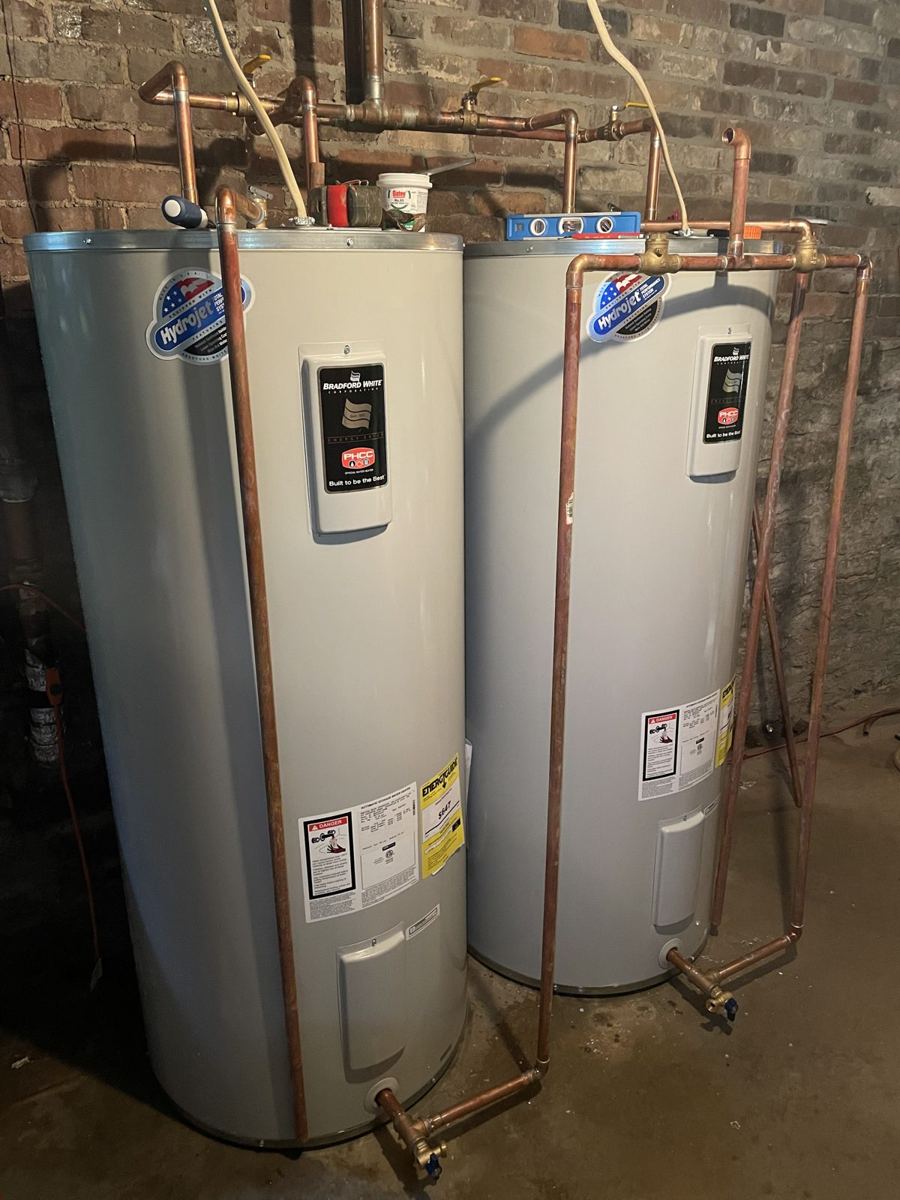 Two new water heaters with copper piping installed by Good Help Plumbing